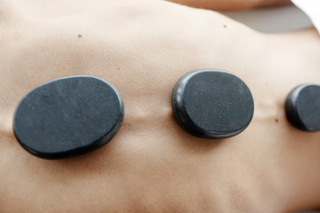 Basalt stones placed on chakras, hot stone massage