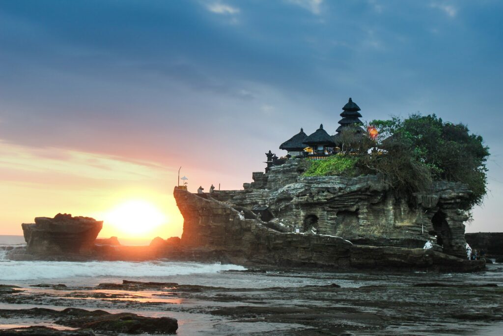 Bali sunrise overlooking temple by the sea