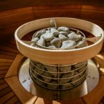 Sauna benefits for wellness and recovery, hot stones inside sauna