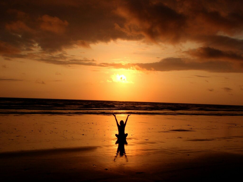 Woman on the beach, mindfulness posture