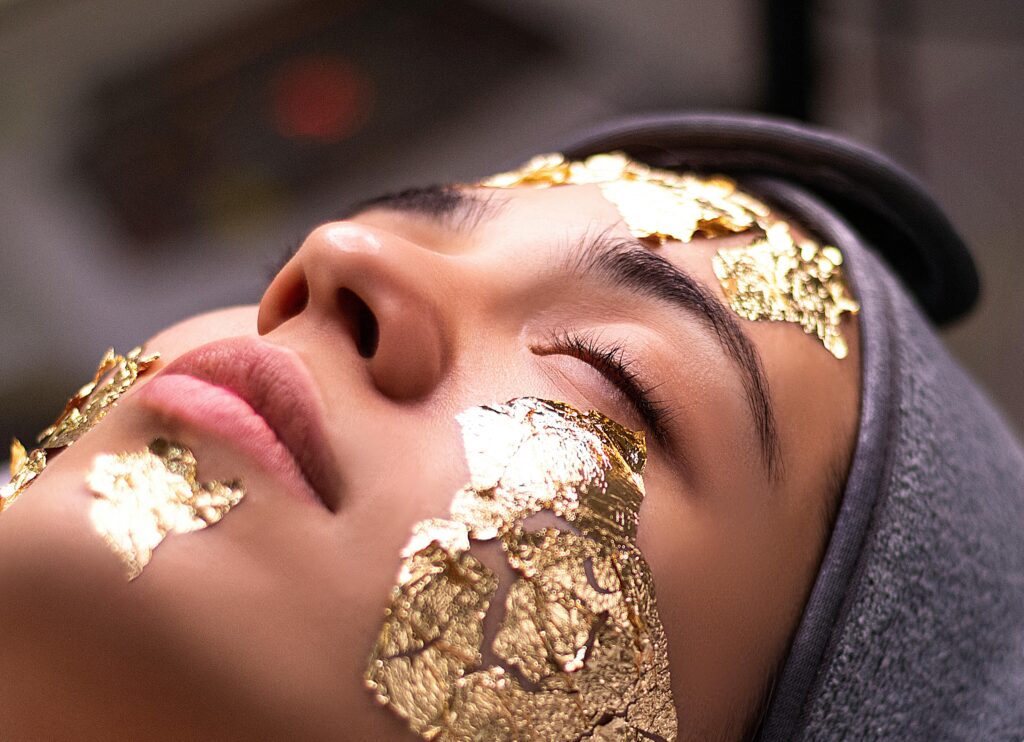lady with gold mask on her face for wellness treatment