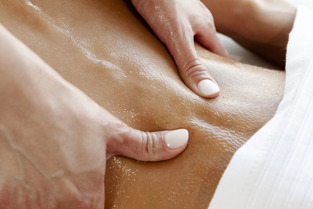 Hands on the lower back, massage technique