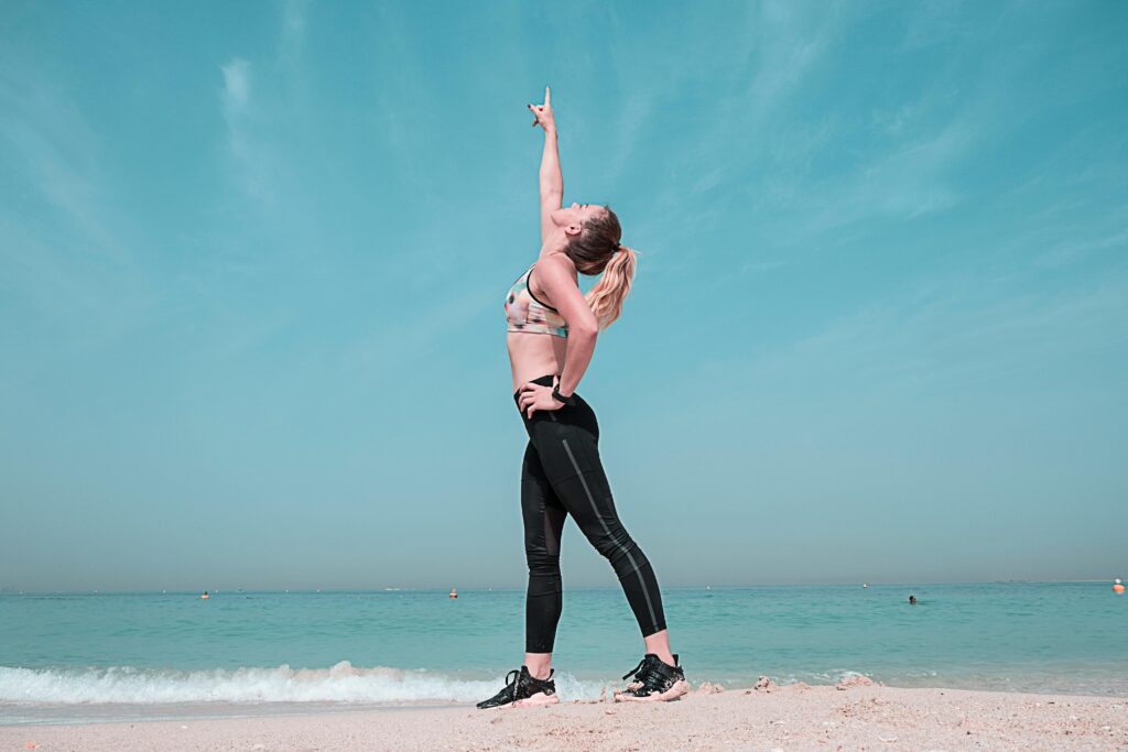 Woman stretching on the beach