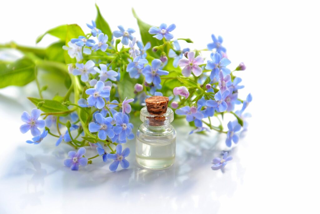Body massage oil, natural blue flowers and cristal oil botle