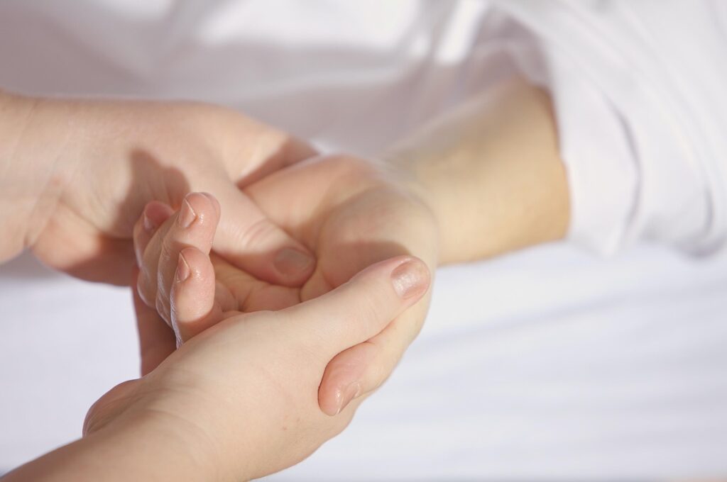 Hand massage technique provided by massage therapist 
