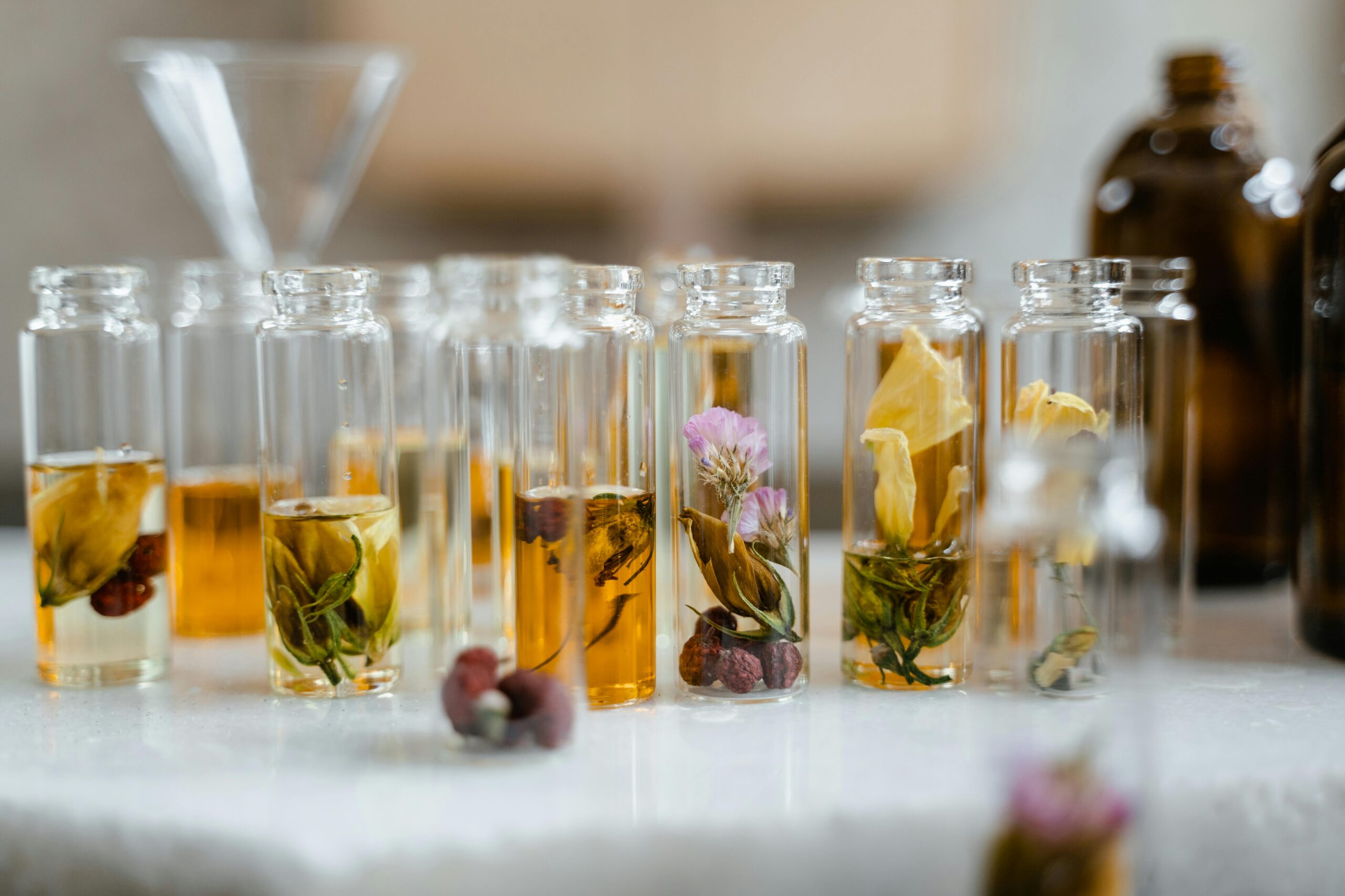 Multiple botles with natural plants, essential oil blend, massage oil, botanical oil