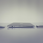 Apple computer, mouse and iphone on a table