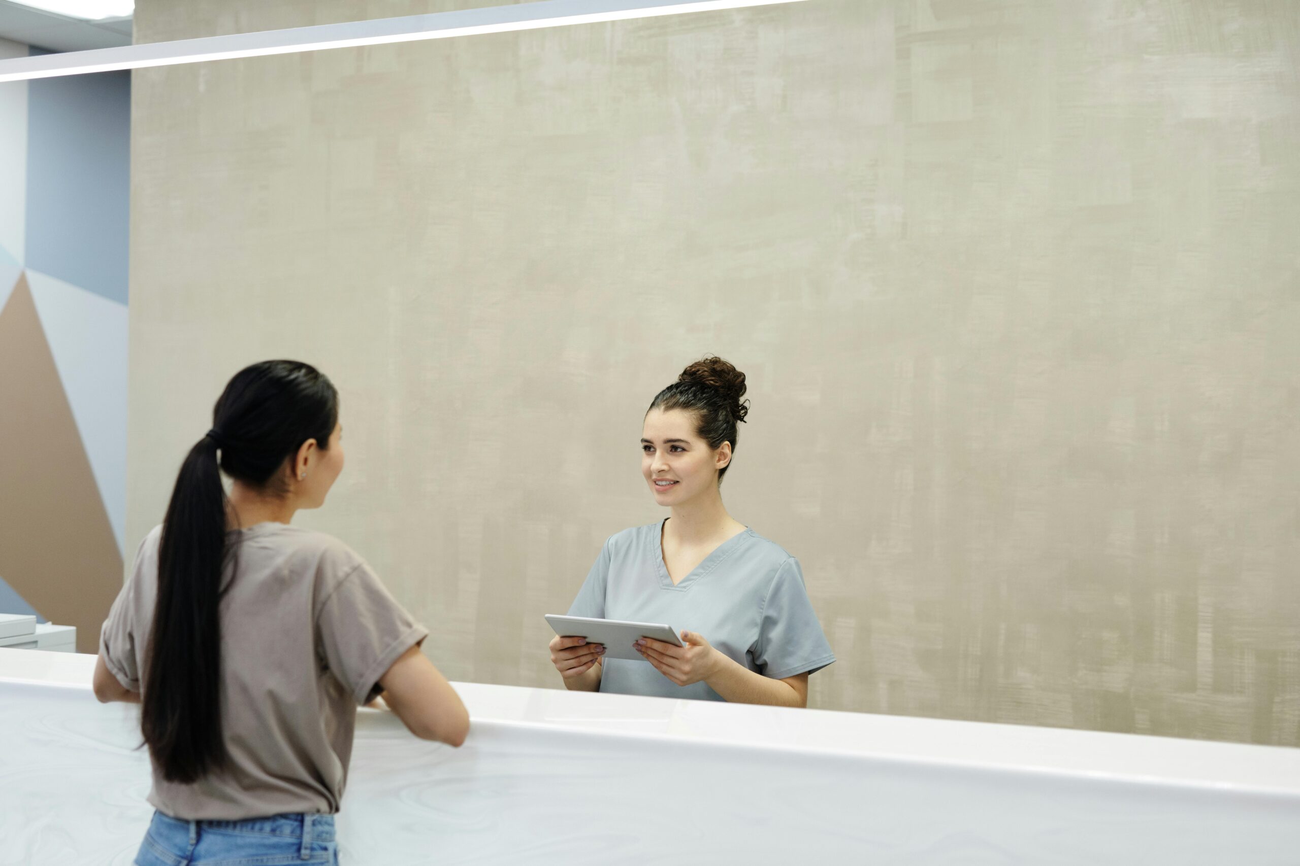 Two woman in reception, massage revenue