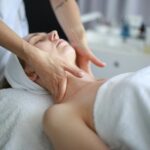 Premium massage experience, client receiving a neck massage from therapist