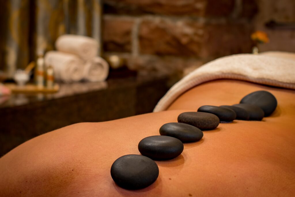 Raise massage prices through hot stone massage
