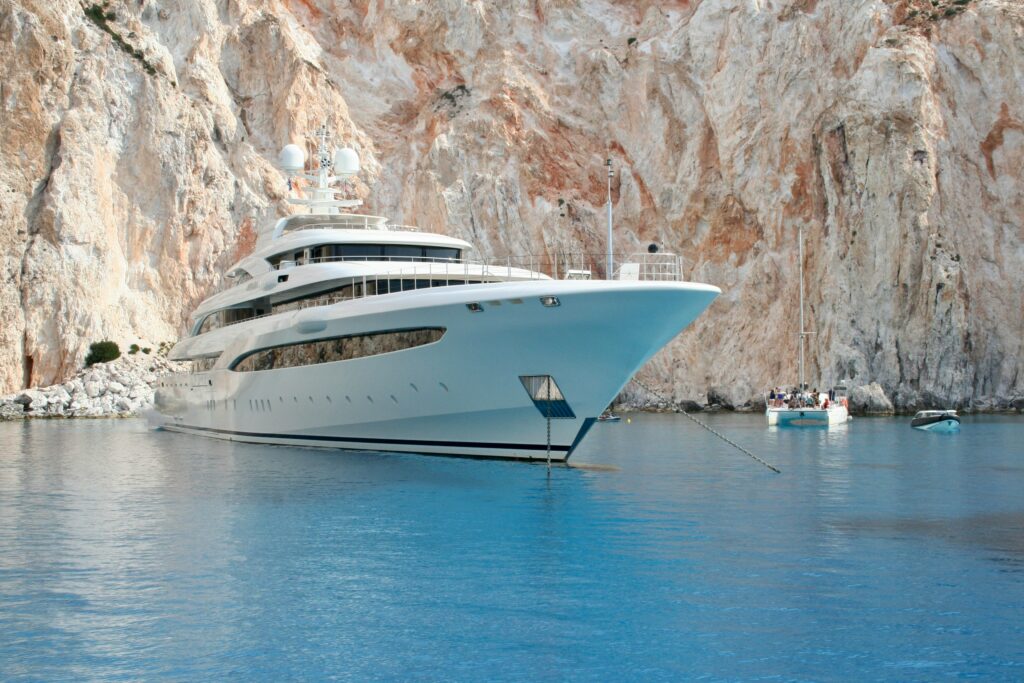 Yacht near rock wall