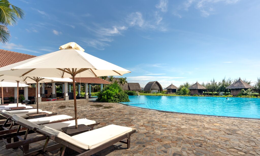 Hotel resort, umbrellas , lounge chairs and infinity pool